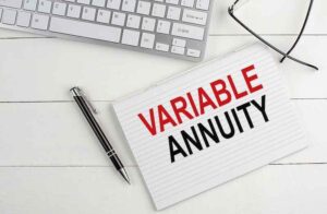 The words “VARIABLE ANNUITIES” on a note card next to a pen.