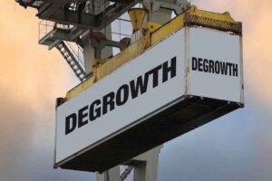 A shipping container with the word “DEGROWTH” on it.