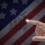 A person pointing at the American flag.