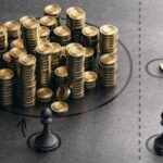 Two pawns standing next to different sized stacks of coins.