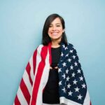 A woman with an American flag around her.